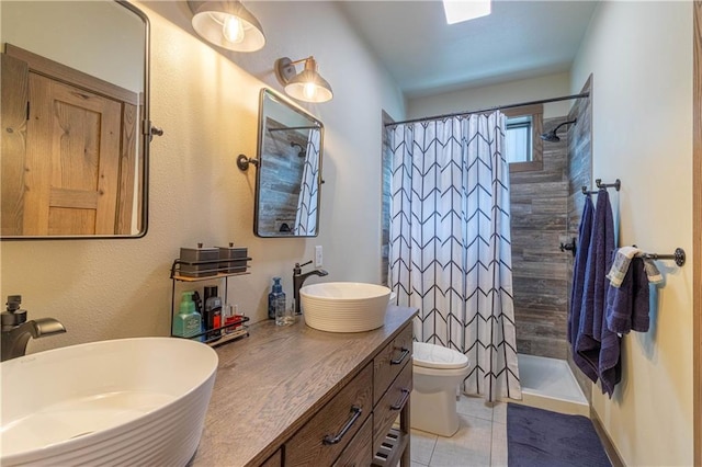 bathroom with toilet, walk in shower, vanity, and tile patterned flooring