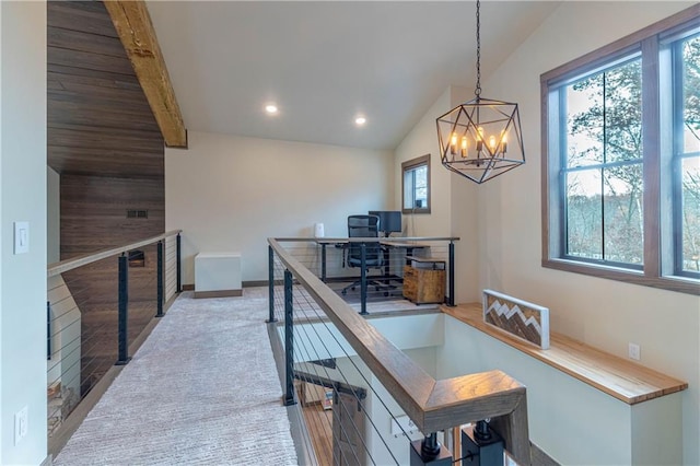 office area with light wood-type flooring, an inviting chandelier, and vaulted ceiling with beams