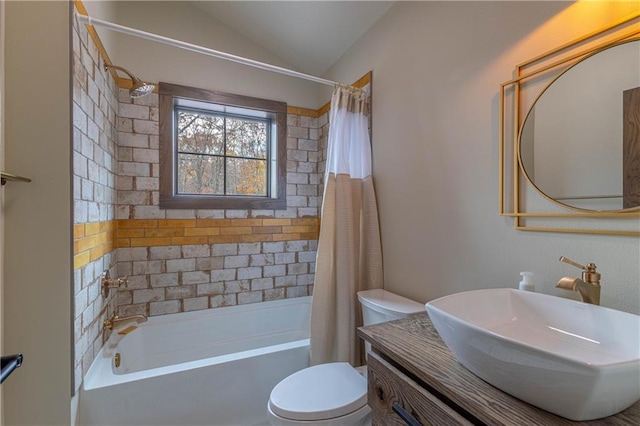 full bathroom with toilet, shower / bath combo with shower curtain, vanity, and vaulted ceiling