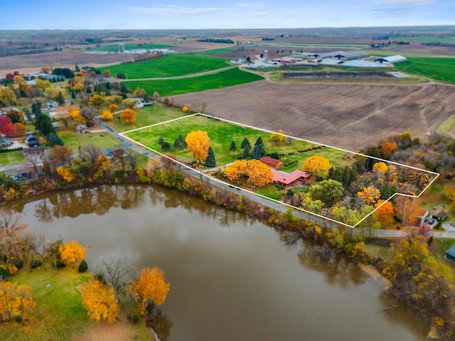 drone / aerial view with a rural view and a water view