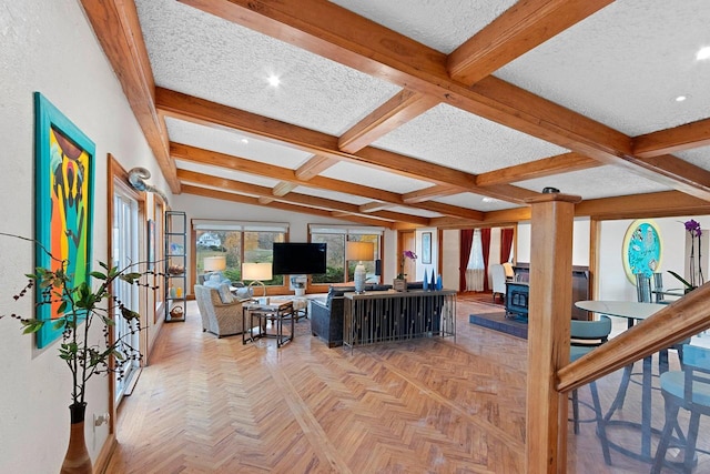 living room with a textured ceiling, a wood stove, lofted ceiling with beams, light parquet floors, and coffered ceiling