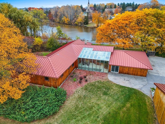 birds eye view of property with a water view