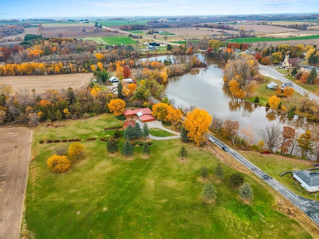 drone / aerial view with a water view and a rural view