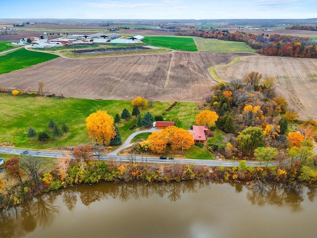 birds eye view of property featuring a water view and a rural view