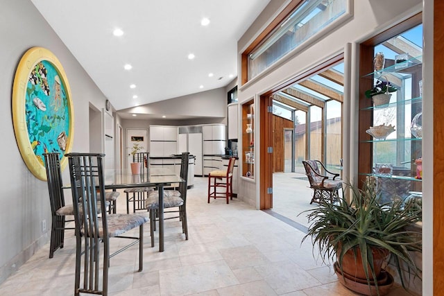 dining area with vaulted ceiling