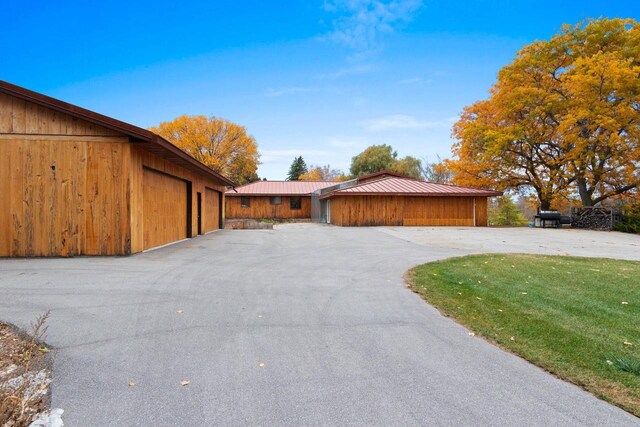 exterior space with a front yard and a garage