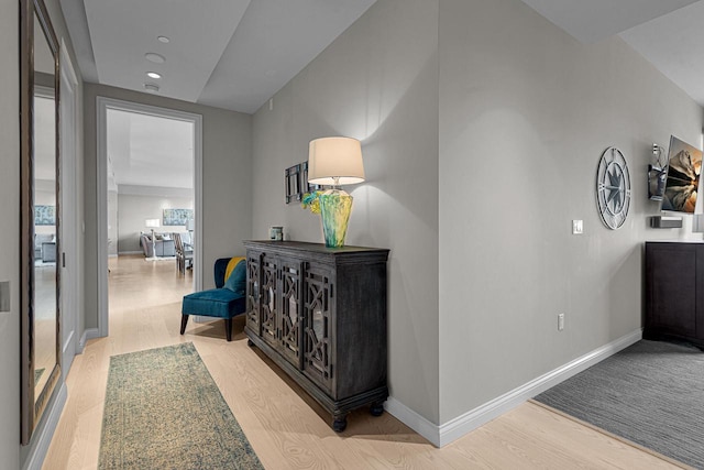 hall with light hardwood / wood-style floors