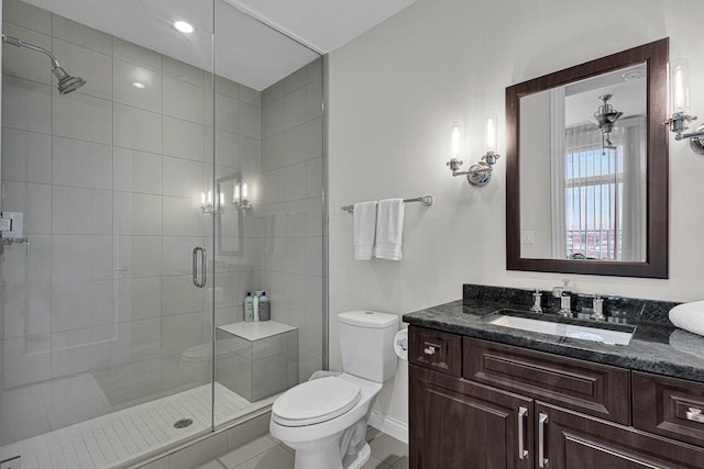 bathroom with vanity, toilet, tile patterned flooring, and an enclosed shower