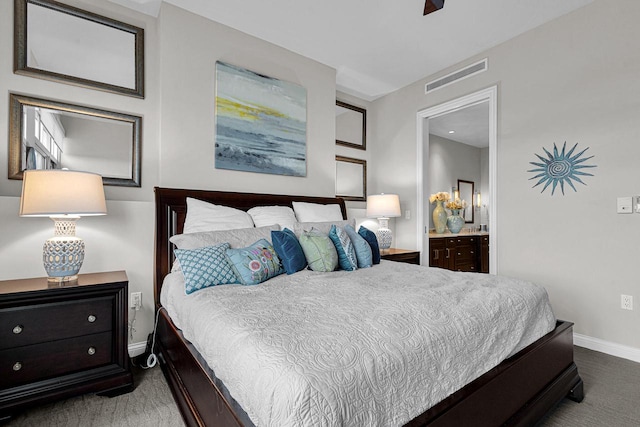 carpeted bedroom with ensuite bathroom