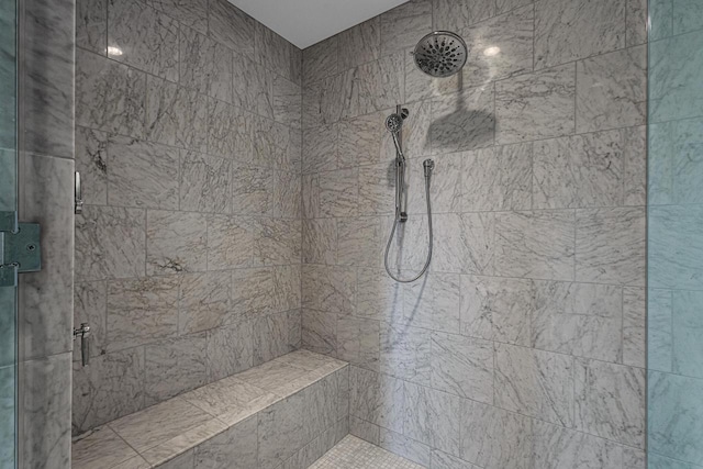 bathroom with a shower with shower door