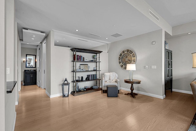 sitting room with light wood-type flooring