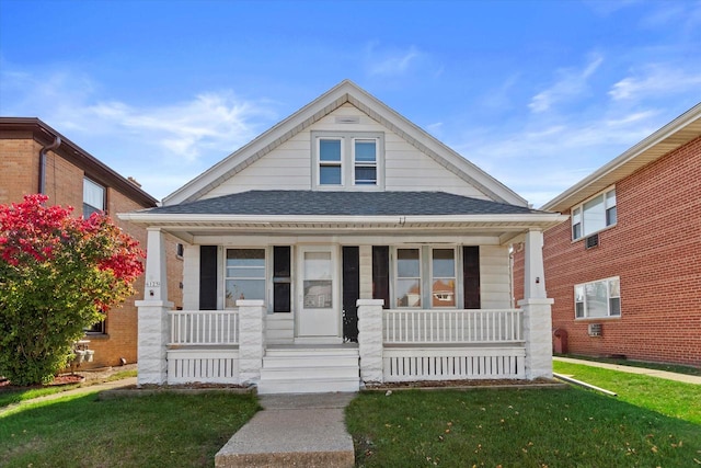 view of front of property featuring a porch and a front lawn