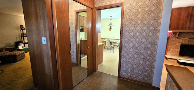 hallway featuring dark parquet flooring