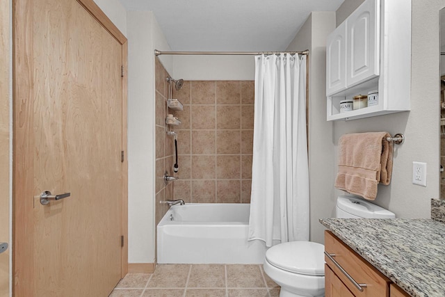 full bathroom featuring toilet, shower / bath combo, vanity, and tile patterned floors