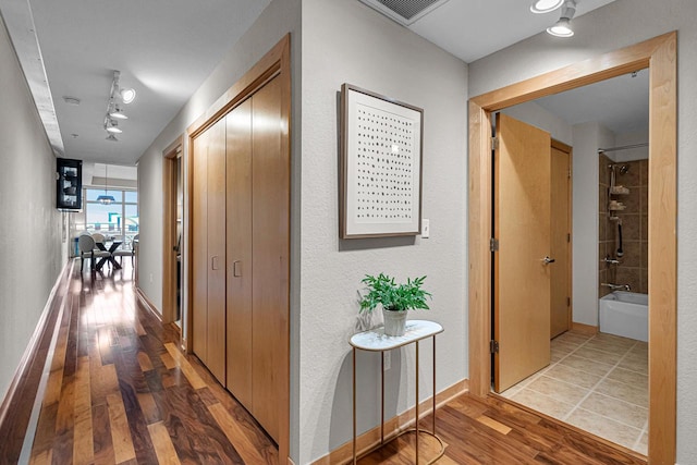 hallway featuring hardwood / wood-style floors