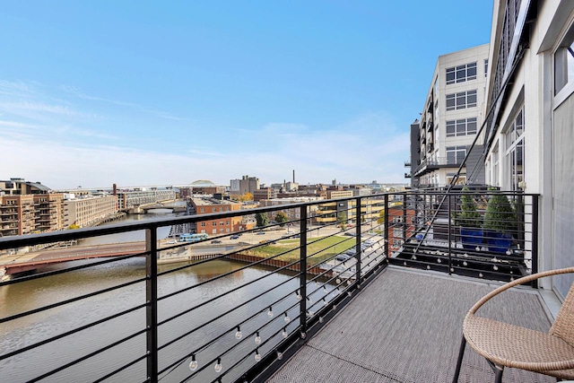 balcony featuring a water view