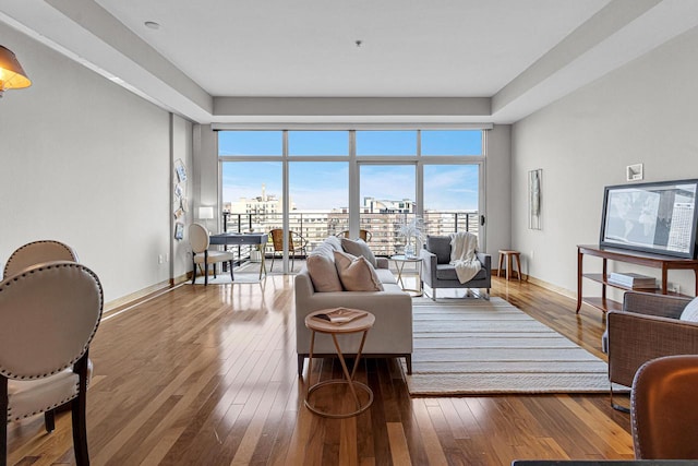 living room featuring wood-type flooring and a wealth of natural light