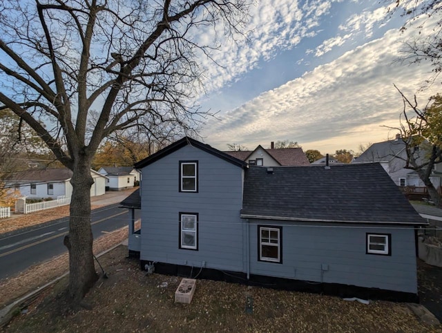 view of back house at dusk