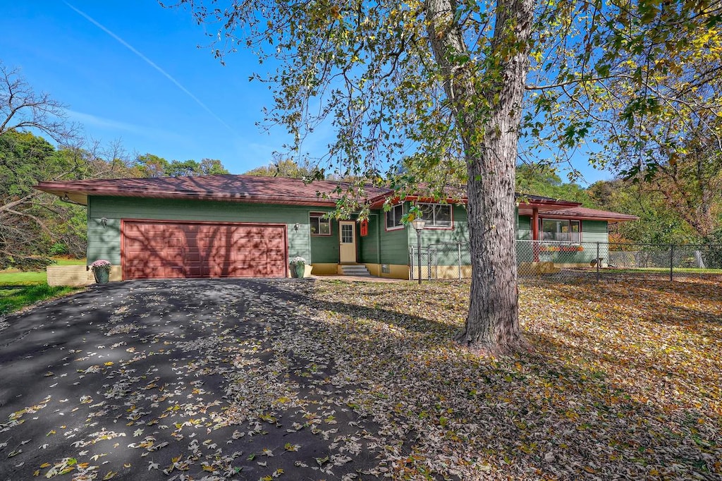 single story home featuring a garage