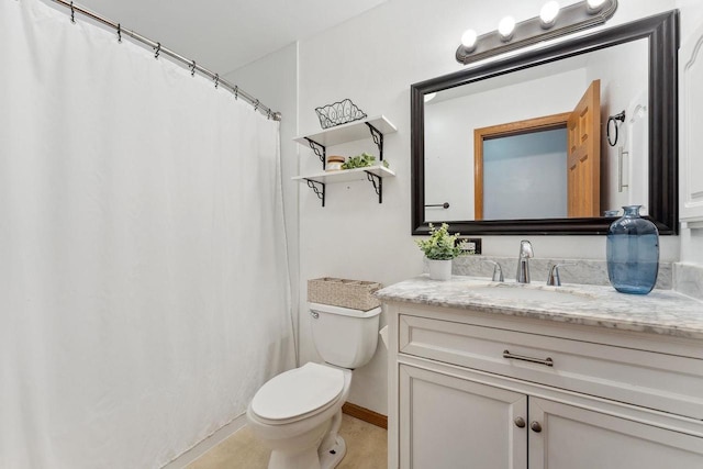 bathroom with vanity, toilet, and tile patterned flooring