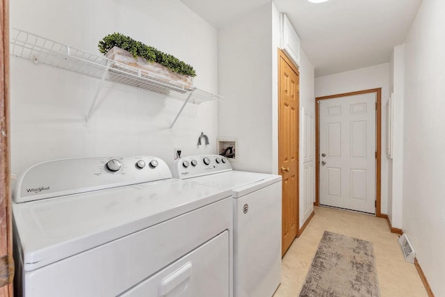 laundry room featuring independent washer and dryer