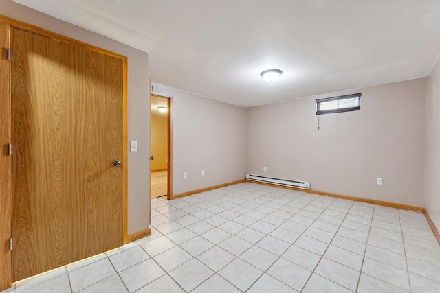 basement with baseboard heating and light tile patterned floors