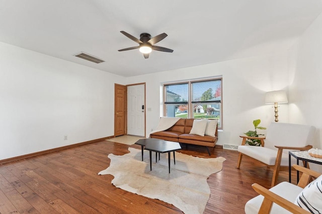 sitting room with ceiling fan and wood-type flooring