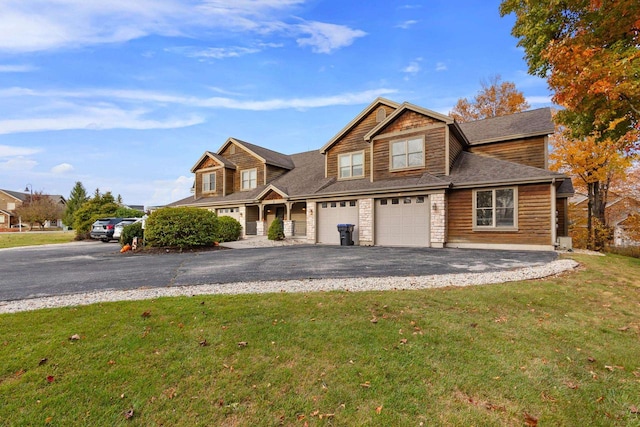 view of front of property with a front lawn and a garage