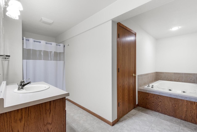 bathroom with vanity, tile patterned floors, and a washtub