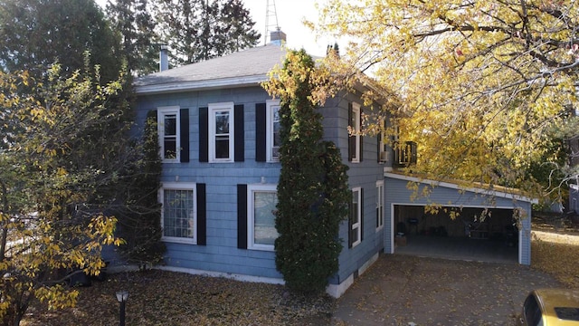 view of side of home with a garage