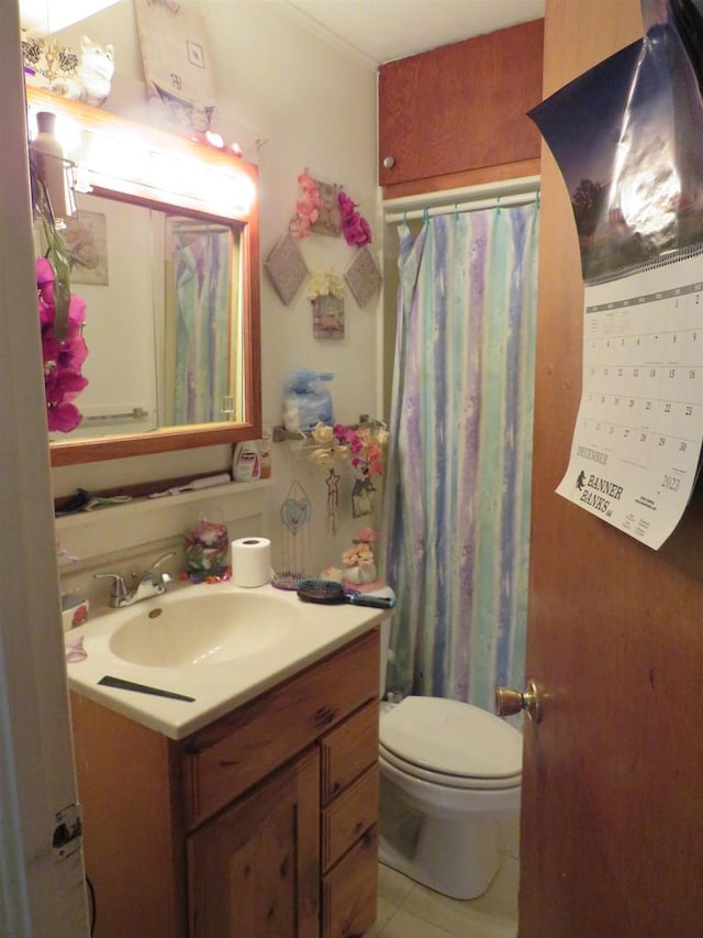 bathroom featuring vanity, toilet, tile patterned flooring, and a shower with shower curtain