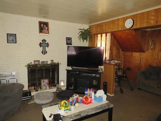 carpeted living room with wooden walls