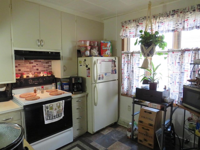 kitchen with white appliances and tasteful backsplash