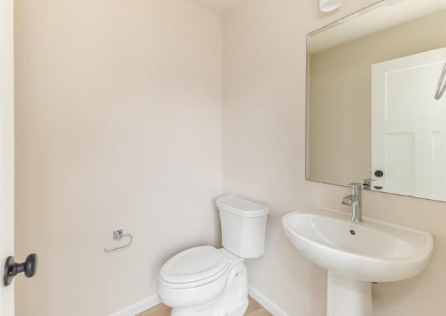 bathroom with toilet and sink