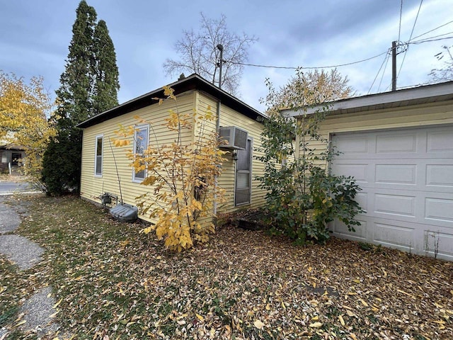 view of property exterior with a garage