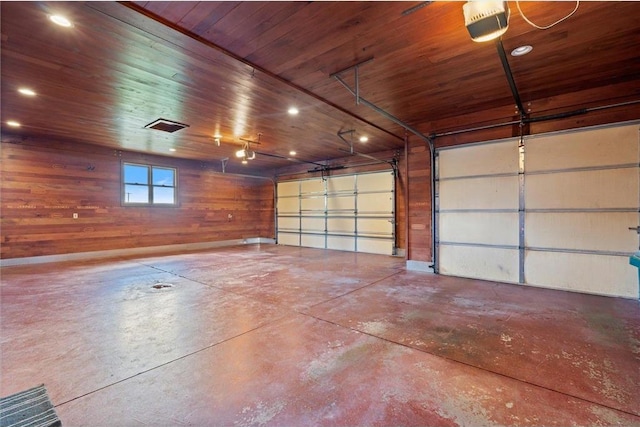 811 130th St, Roberts, WI 54023 - garage with wooden ceiling, wooden walls, a garage door opener, and recessed lighting