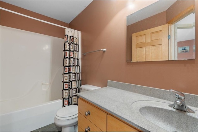 full bathroom with vanity, shower / bath combo with shower curtain, and toilet