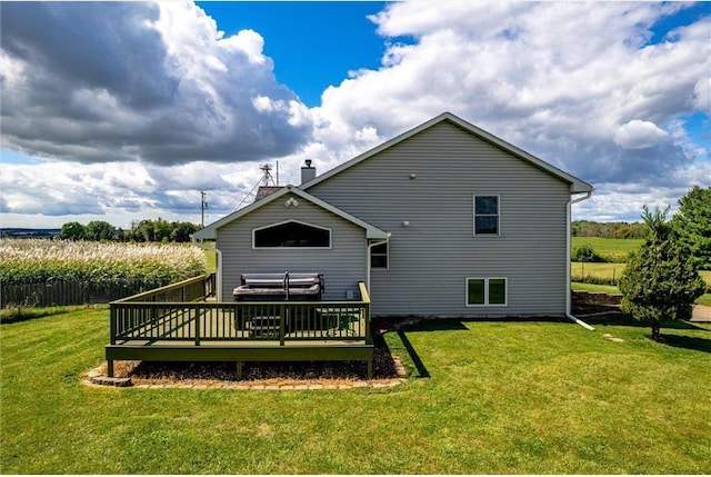 811 130th St, Roberts, WI 54023 - back of property featuring a lawn, a chimney, a wooden deck, and a rural view