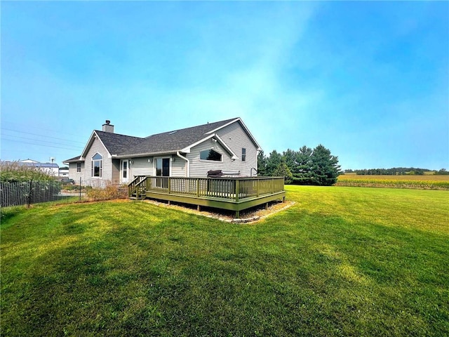 811 130th St, Roberts, WI 54023 - back of house featuring fence, a deck, a chimney, and a lawn