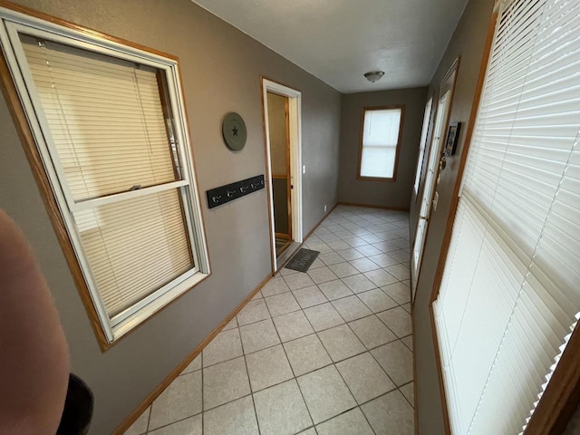 entryway with light tile patterned floors