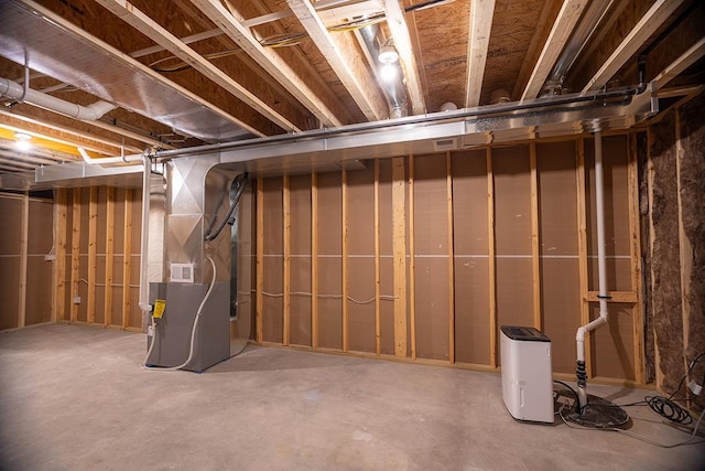 basement featuring heating unit