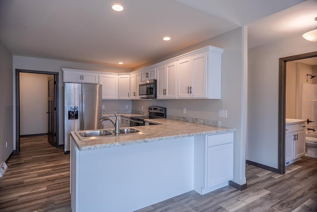 kitchen featuring sink, appliances with stainless steel finishes, and white cabinets