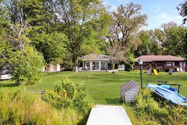 view of yard featuring a shed and a playground