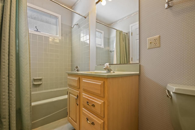 full bathroom with vanity, toilet, shower / tub combo, and plenty of natural light