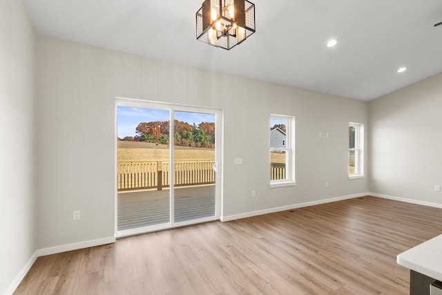 interior space featuring a notable chandelier and light hardwood / wood-style floors