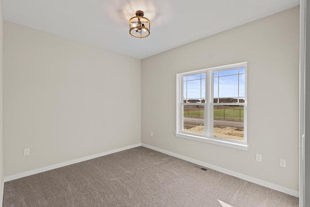 empty room featuring carpet floors