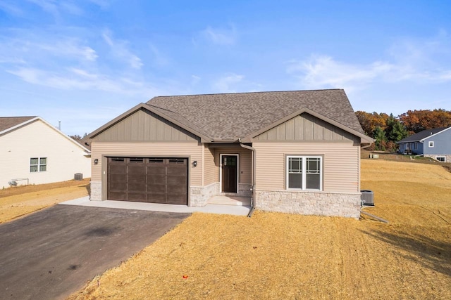 view of front of house with a front lawn and a garage