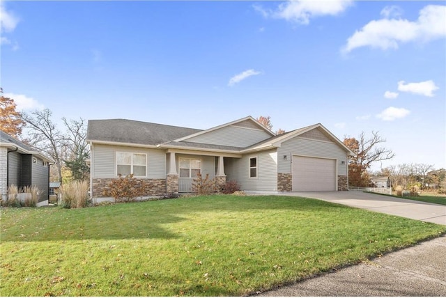 view of front facade featuring a garage and a front lawn