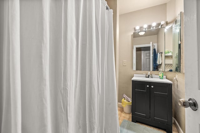 bathroom with vanity and tile patterned flooring