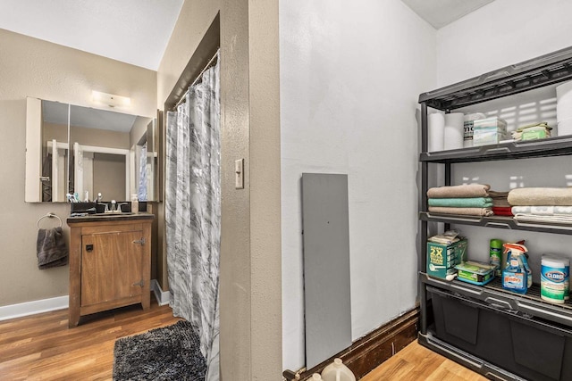 bathroom featuring vanity and hardwood / wood-style floors